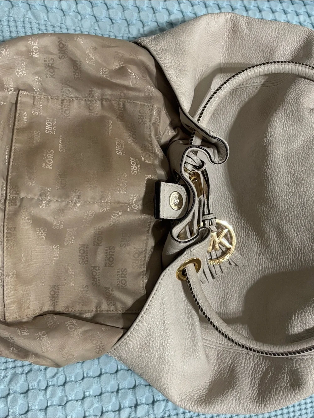 Michael Kors Cream Leather Drawstring Shoulder Bag with Tassel and Gold Hardware